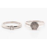 A single stone diamond ring and a diamond cluster ring, featuring a claw set round brilliant cut