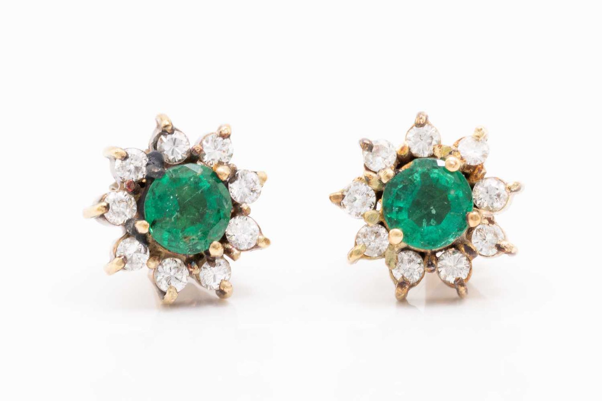 A pair of yellow metal, emerald and diamond earrings, of floral cluster design, each set with a - Image 2 of 3