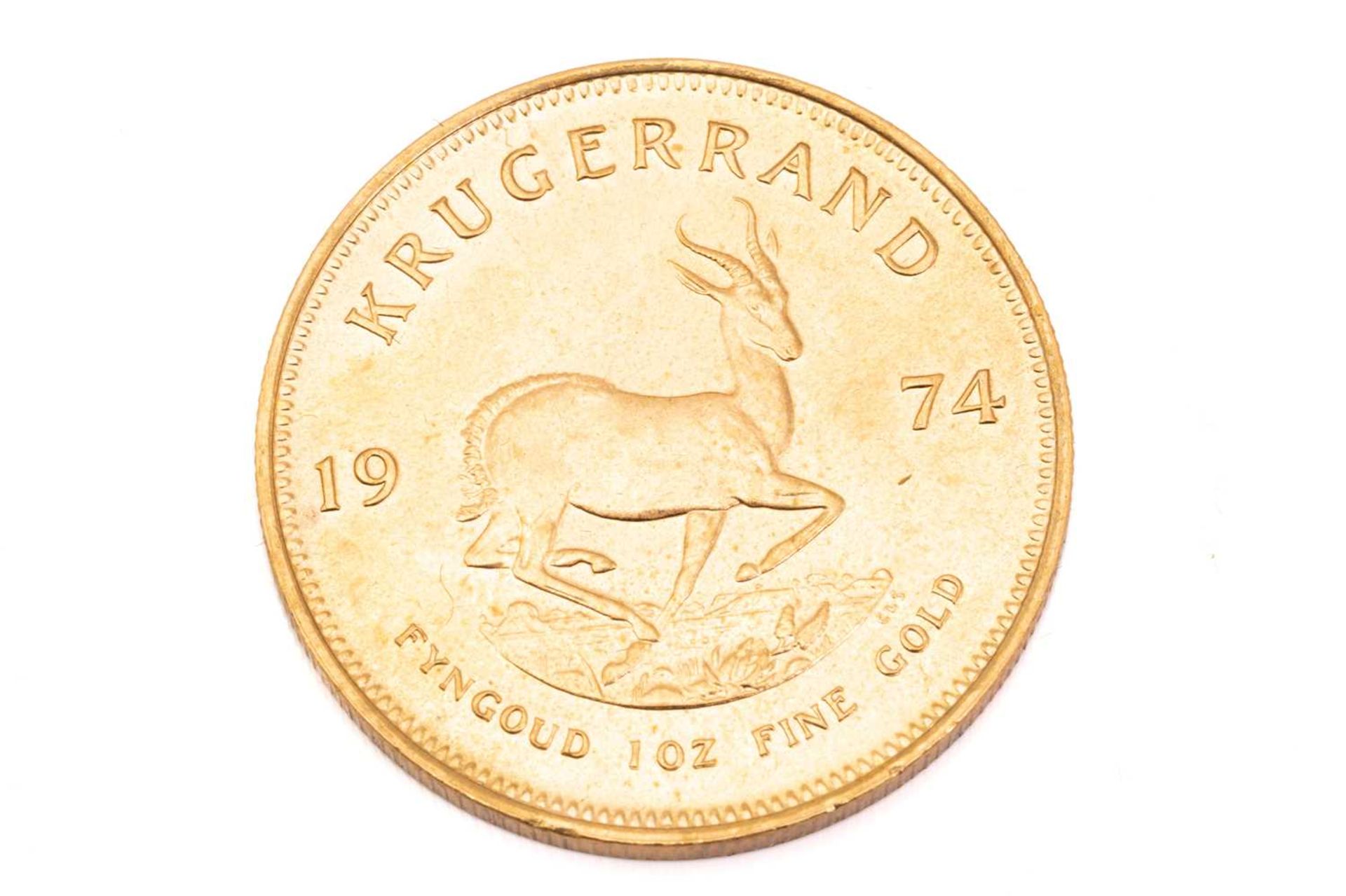 A 1oz 22ct gold South Africa Krugerrand, 1974Obv: some toned spots and light surface marks. Rev: - Image 3 of 3