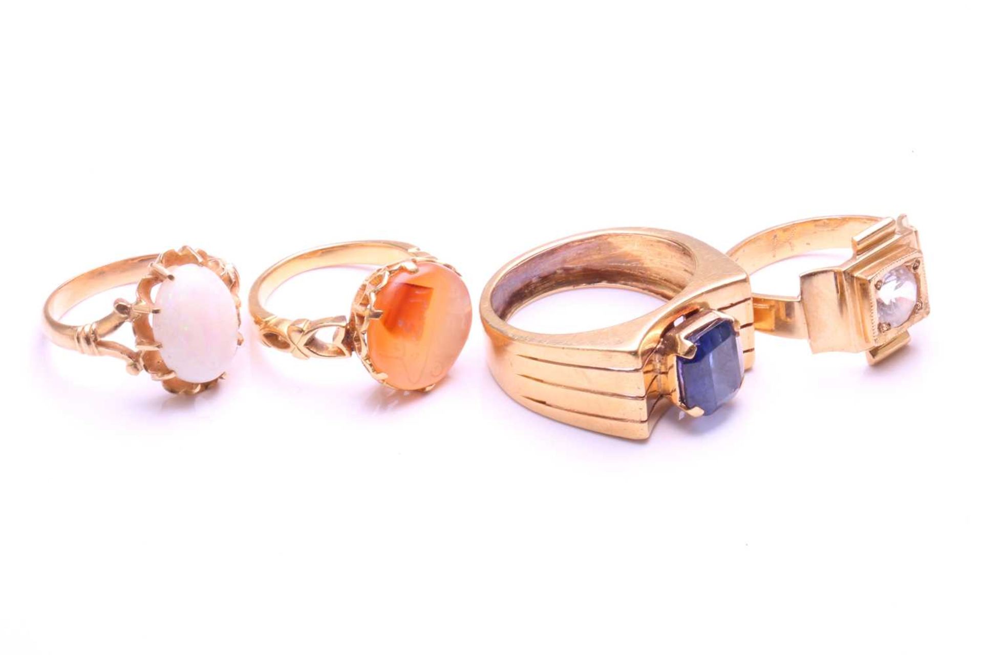 Four gem-set rings, including an Aqeeq ring with a round carnelian in coronet setting, engraved with - Image 3 of 4