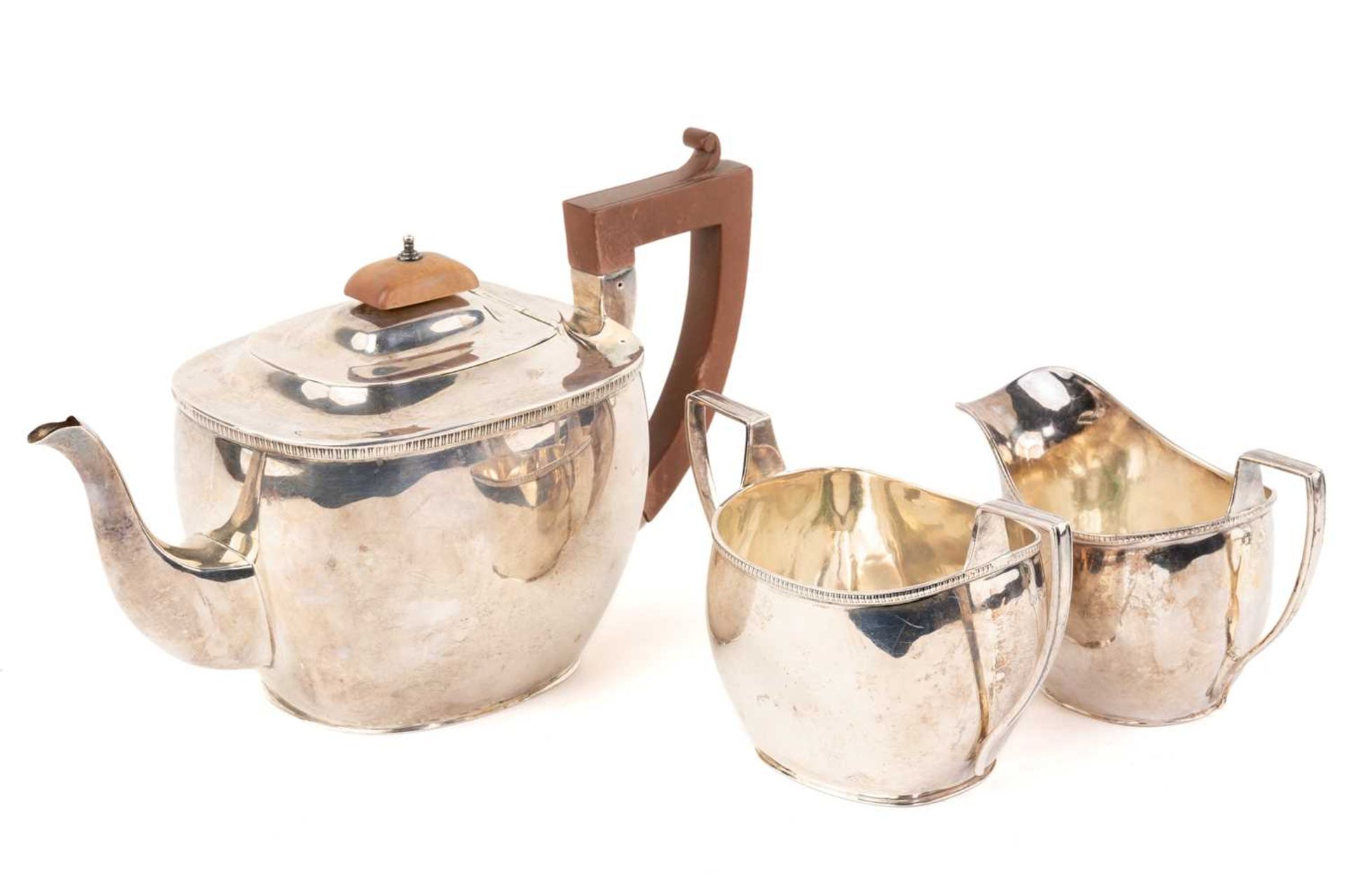 An early 20th-century three-piece silver tea set, Chester 1911 by Blackensee & Sons, comprising a