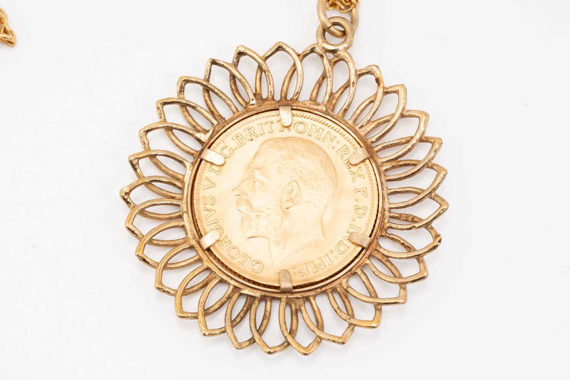 A sovereign pendant on chain; the sovereign dated 1913, in 9 carat gold openwork mount; to an - Image 3 of 4