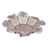 A probably 19th century Indo-Portuguese circular silver filigree dish with a shaped lunette rim