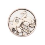 Georg Jensen - A circular brooch pierced and cast with two ducks, designed by Hugo Liisberg,