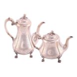 A mid Victorian teapot and coffee pot; of fluted low bellied form, domed covers, and cast acorn