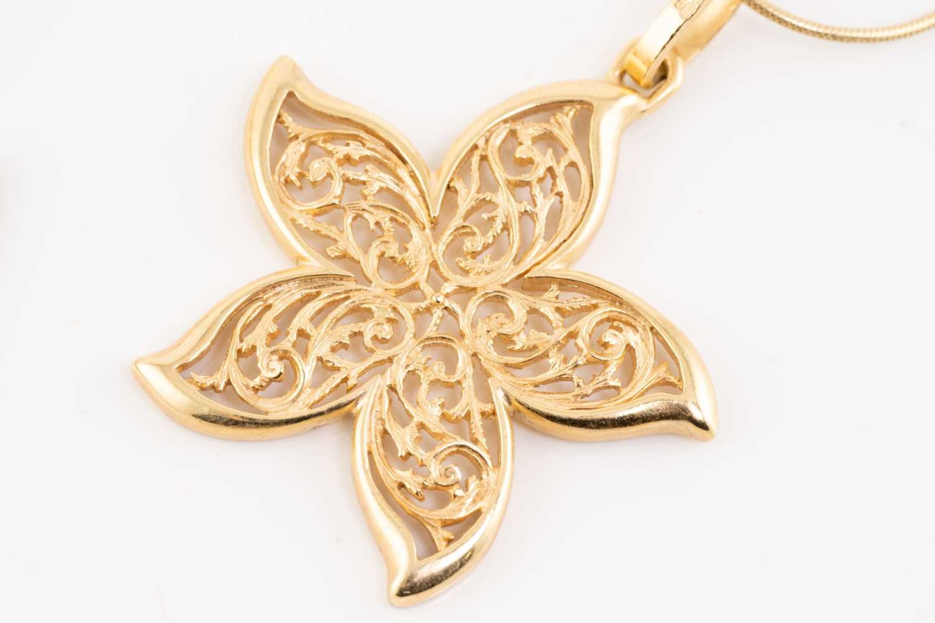 A collection of four pieced-out pendants on chains, including a 10ct gold pierced butterfly - Image 5 of 6