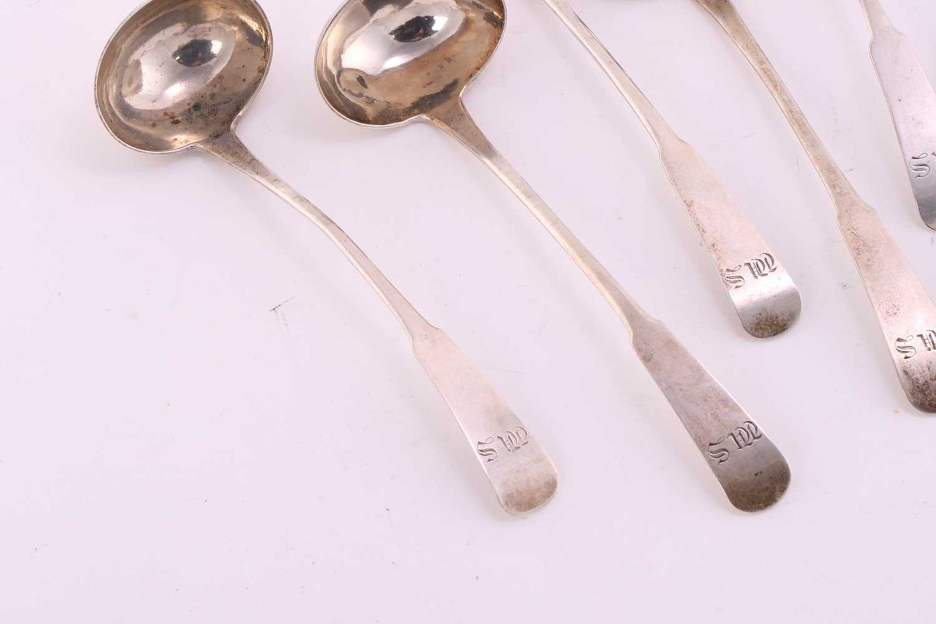 A set of seven fiddle pattern sauce ladles, probably Scottish provincial, circa 1780-1790; - Image 4 of 10