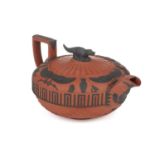 A large Wedgwood rosso antico teapot and cover, early 19th century, with applied Egyptian
