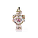 A Dresden porcelain flower encrusted baluster vase and cover, early/mid 20th century, with high