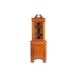 An Edwardian mahogany and Neo-Classical marquetry inlaid freestanding corner display cabinet, in the