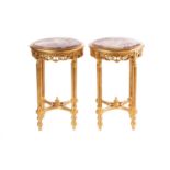 A pair of Louis XVI style carved and gilt pedestal jardinières,20th century, with circular rouge