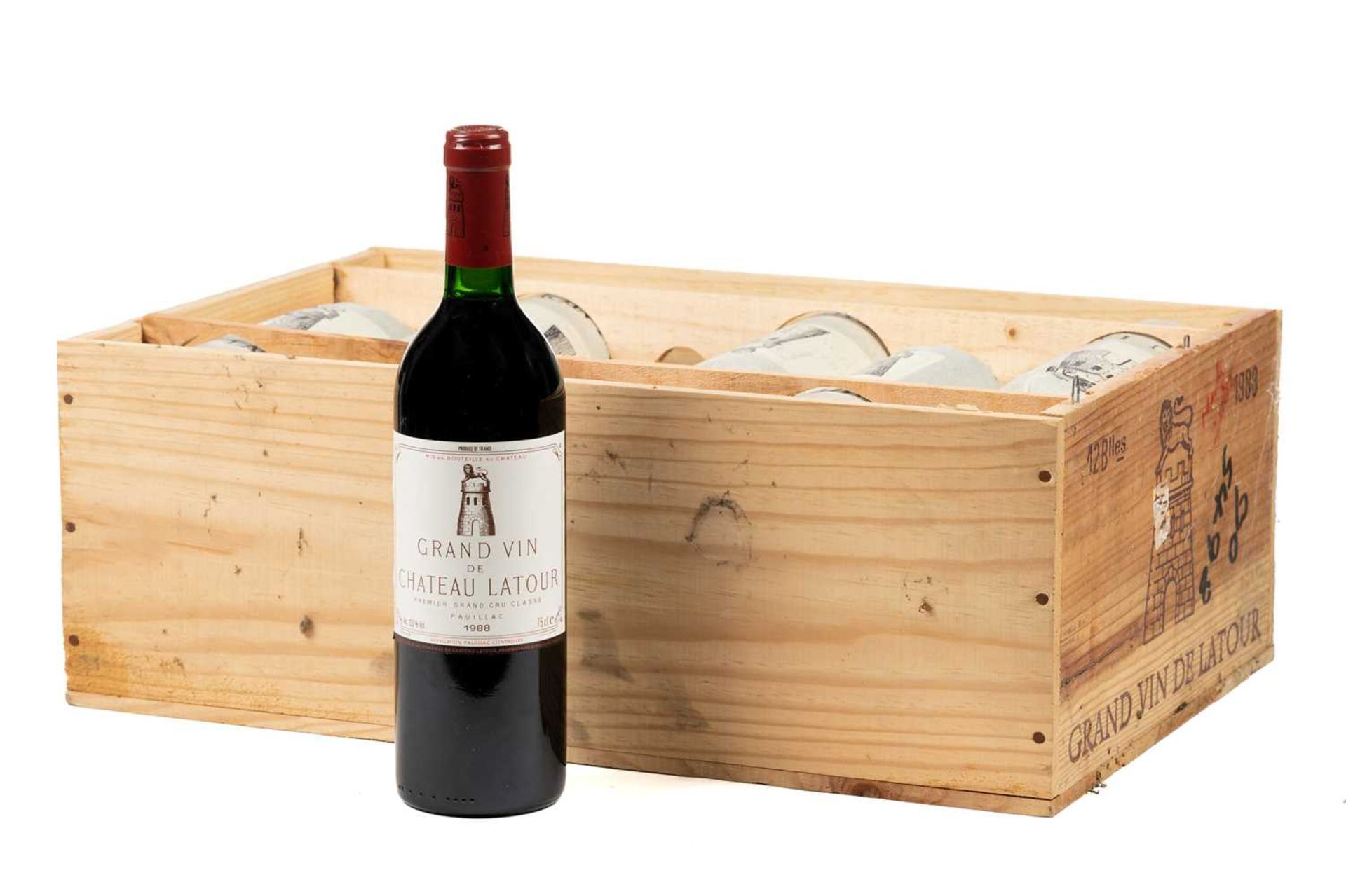 A twelve bottle case of Grand Vin de Chateau Latour, 1988, tissue wrapped bottles, ullage bottom