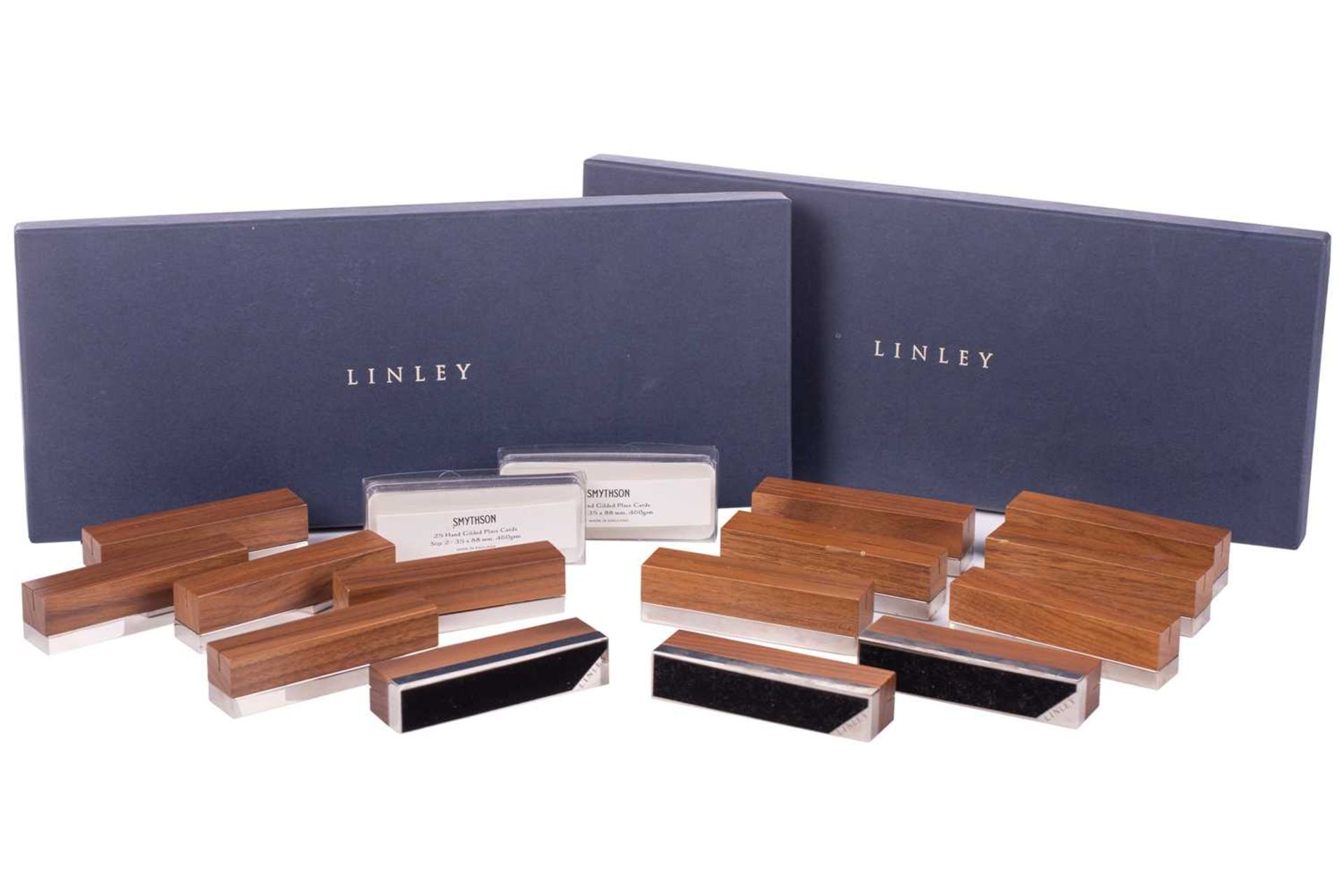 David Linley: two boxed sets of eight English walnut and silver plated rectangular name place stands