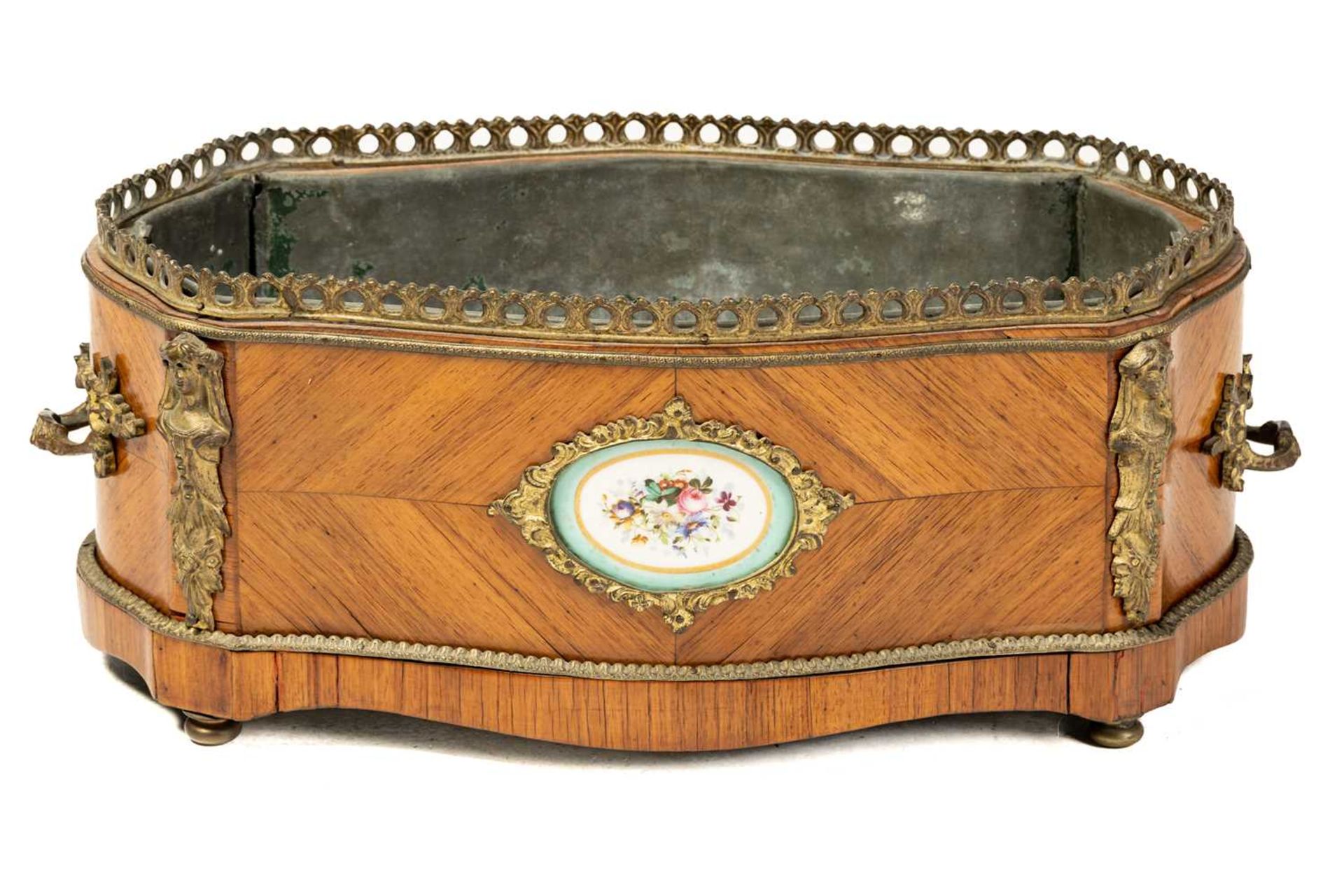 A Napoleon III style king wood table jardiniere of serpentine outline, C1900, with gilt metal