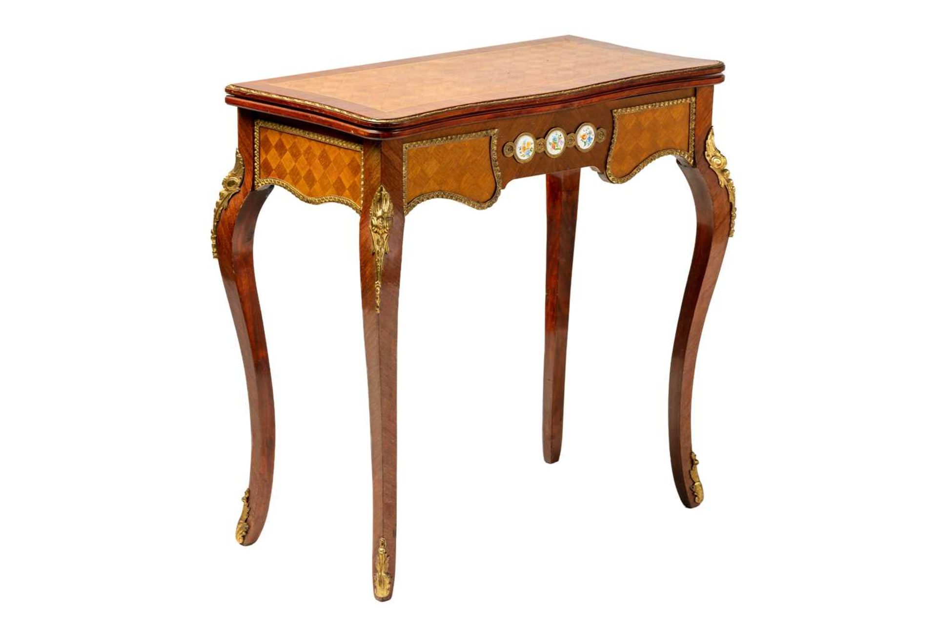 A Louis XV style mahogany and cube parquetry fold over serpentine gaming table, 20th century, the