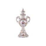 A large German porcelain flower encrusted two handled trophy form urn and cover, 20th century,