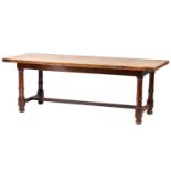 A French rustic oak farmhouse table, 19th century, with cleated scrubbed plank top, supported by