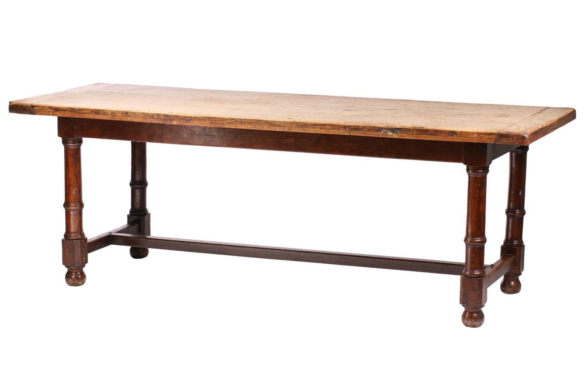 A French rustic oak farmhouse table, 19th century, with cleated scrubbed plank top, supported by