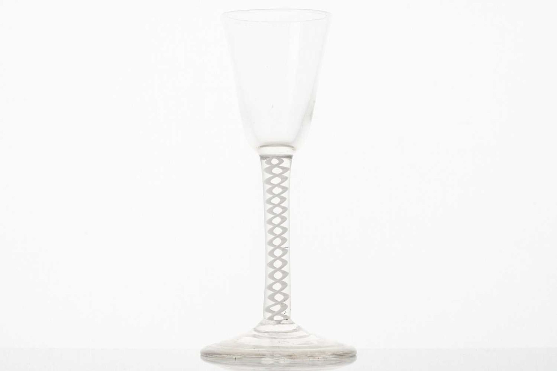 An 18th-century wine glass, the conical bowl over a twin thread opaque air twist stem and conical - Image 2 of 5