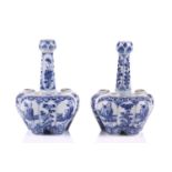 A pair of Chinese blue & white quintal bulb vases, late Qing, with garlic mouth and painted with