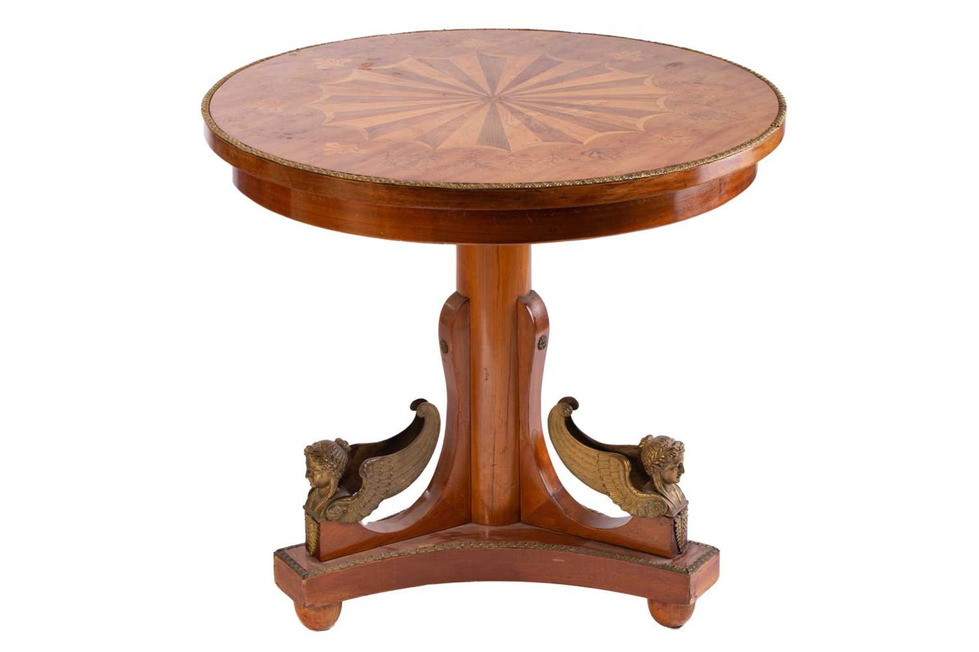 A French Charles X style mahogany gueridon, late 19th century, the circular top with a decorative