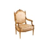 In the manner of George Jacob; a Louis XVI style finely carved wood and gilt gesso fauteuil, late