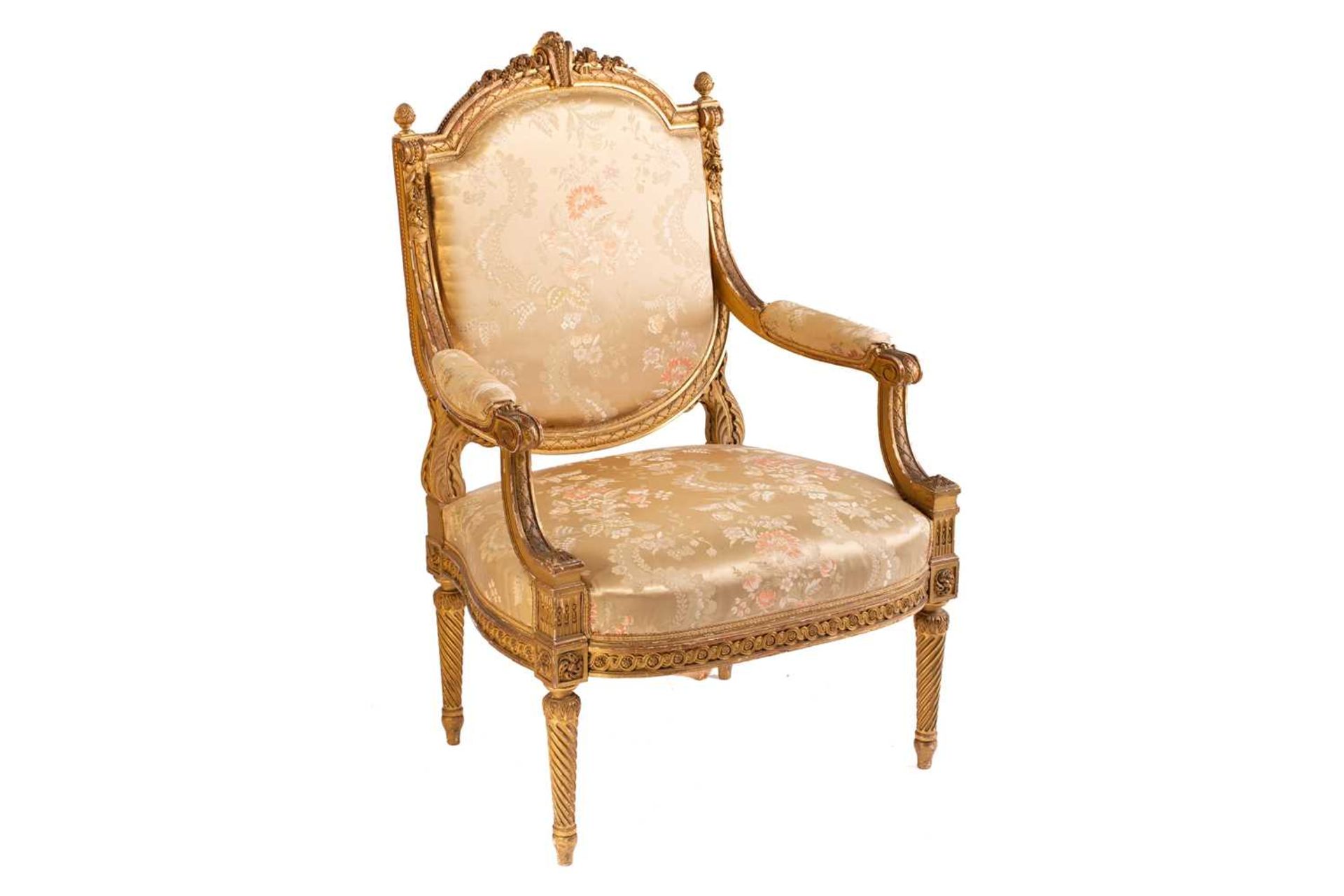 In the manner of George Jacob; a Louis XVI style finely carved wood and gilt gesso fauteuil, late