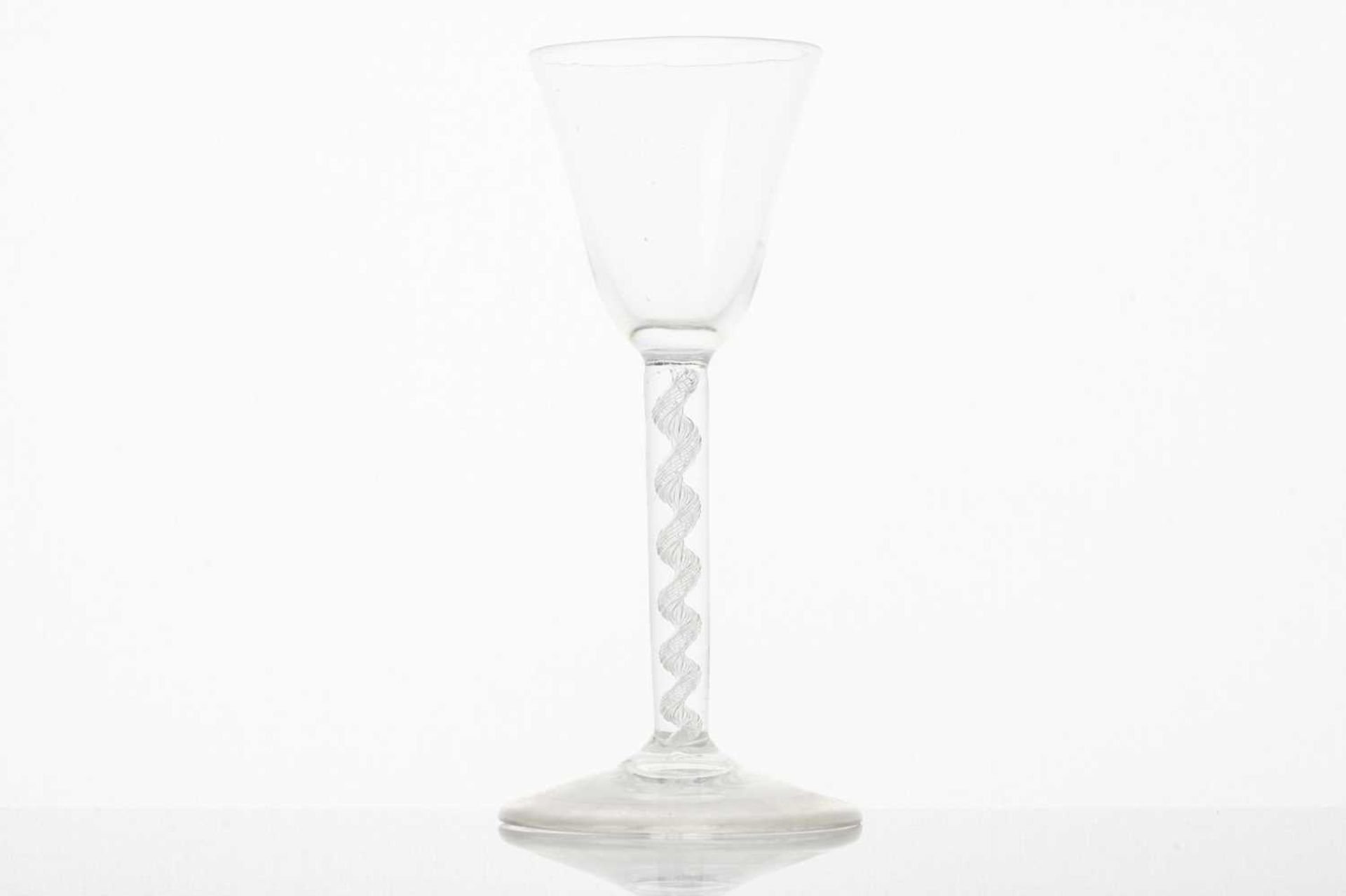 An 18th-century wine glass, the conical bowl over a twin thread opaque air twist stem and conical - Image 4 of 5