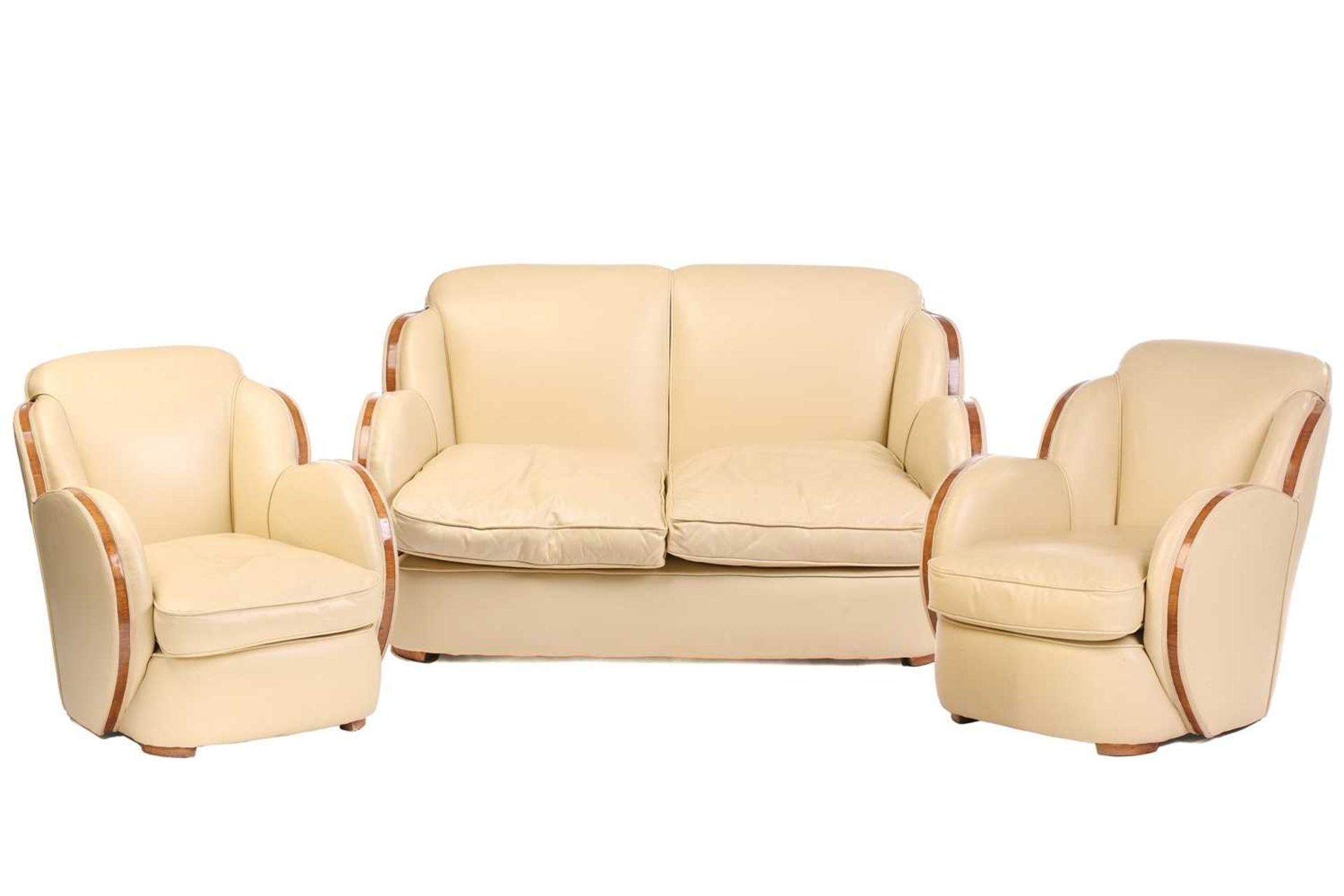 A good quality Art Deco style 'Odeonesque' design ivory hide upholstered Cloud Back three-piece