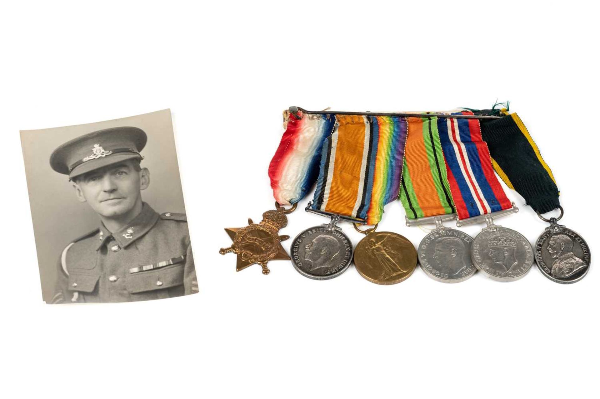 A WWI and WWII medal group, comprising a 1914-15 Star, a WW1 Campaign and a Victory medal, each