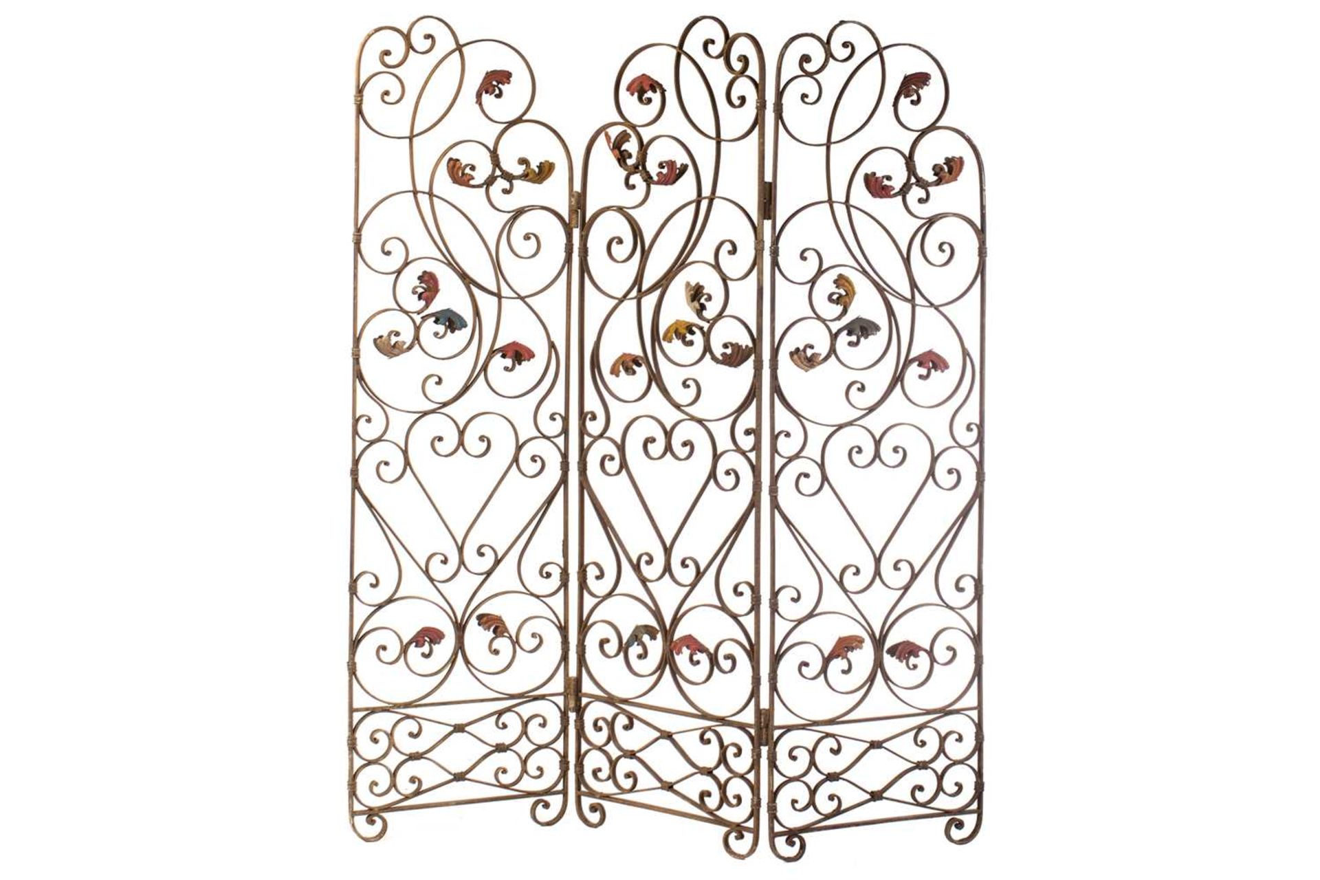 An Italianate wrought iron three panel room screen, 20th century ,with verdigris painted scrolling