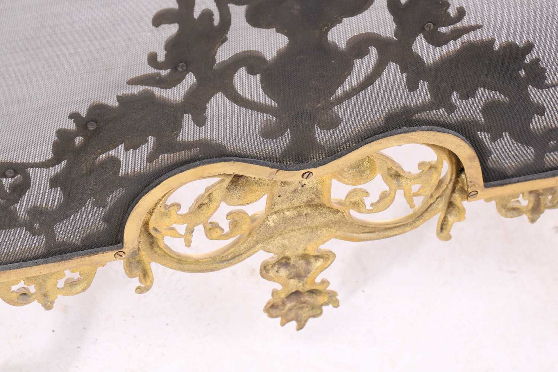 A Louis XVI-style heavy ormolu spark guard, late 20th century, with a shaped arch top above a pieced - Image 8 of 10