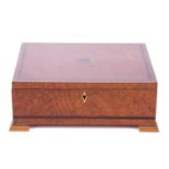David Linley a rectangular amboyna and zebrano strung cigar box, the hinged cover bearing an inset