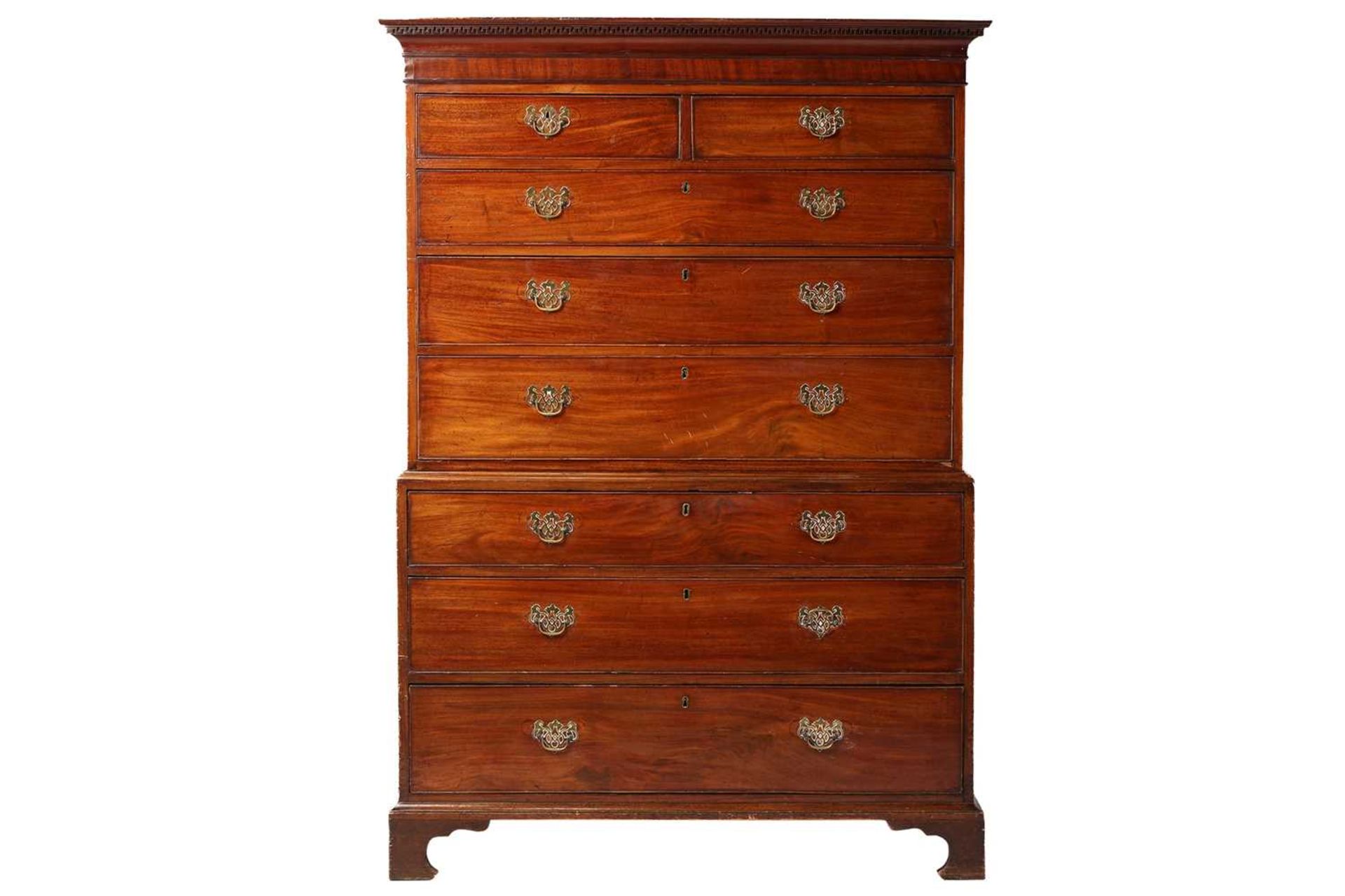 A George III mahogany chest on chest, the upper section with two short over three long drawers and