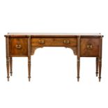 A Regency mahogany sideboard, the rectangular top with rounded corners and ebony strung edge over