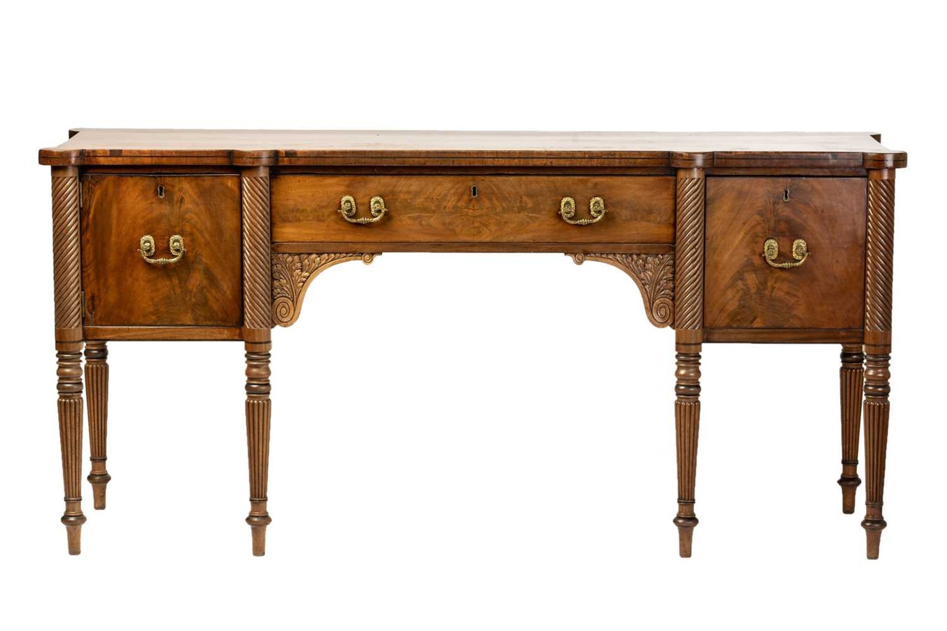 A Regency mahogany sideboard, the rectangular top with rounded corners and ebony strung edge over