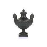 Wedgwood & Bentley, Etruria: a late 18th century black basalt urn and cover, of Classical form