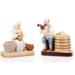 A pair of Russian Gardner porcelain figures of a Peasant Woman churning butter, 13.5 cm high and a
