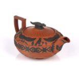 A Wedgwood rosso antico teapot and cover, early 19th century, with applied Egyptian decoration,