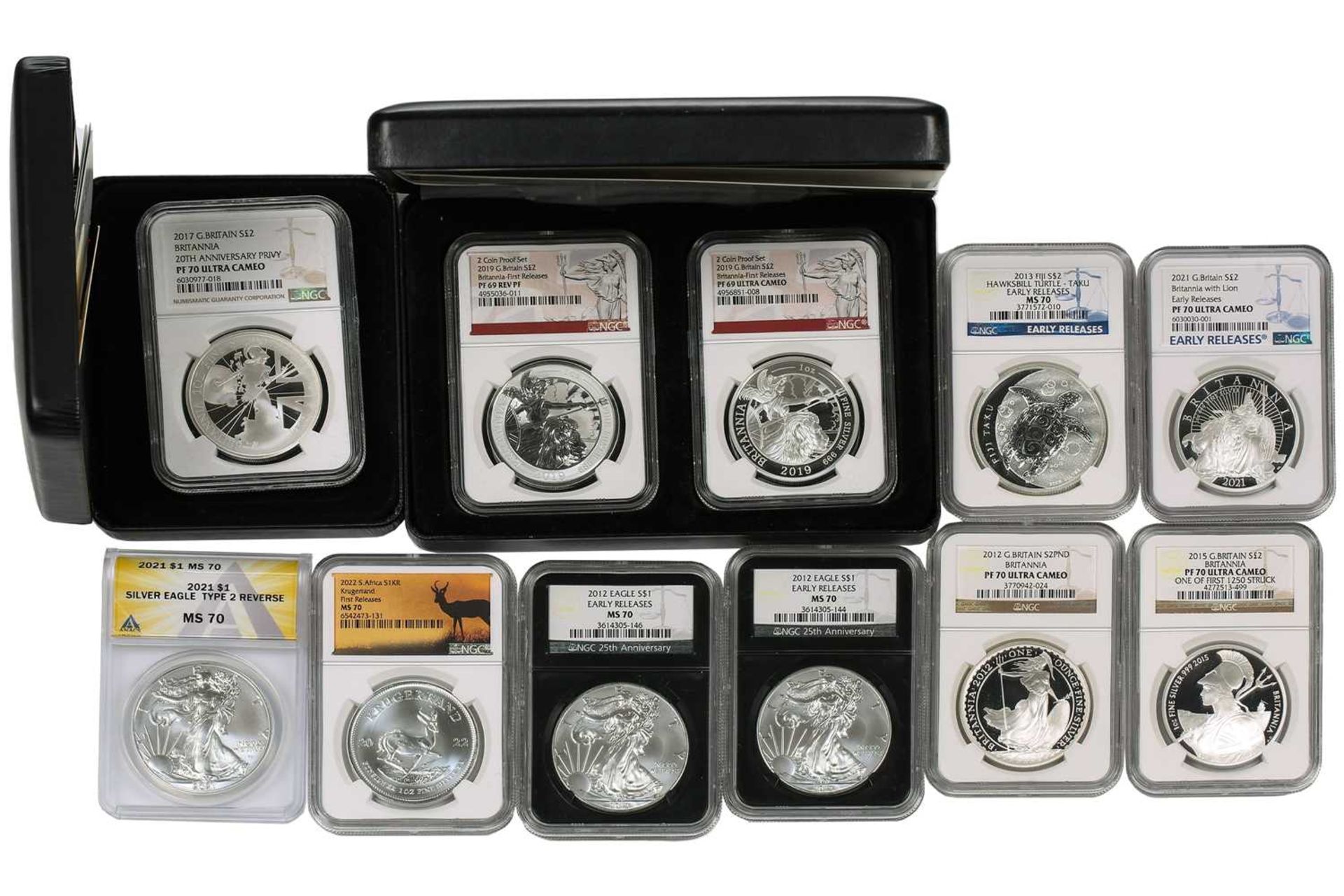 A collection of eleven fine silver proof crown size coins, comprising two coin set Britannia 'The