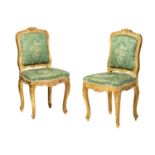 A pair Louis XV style carved wood and gilt gesso salon chairs, 19th century, with shaped cresting