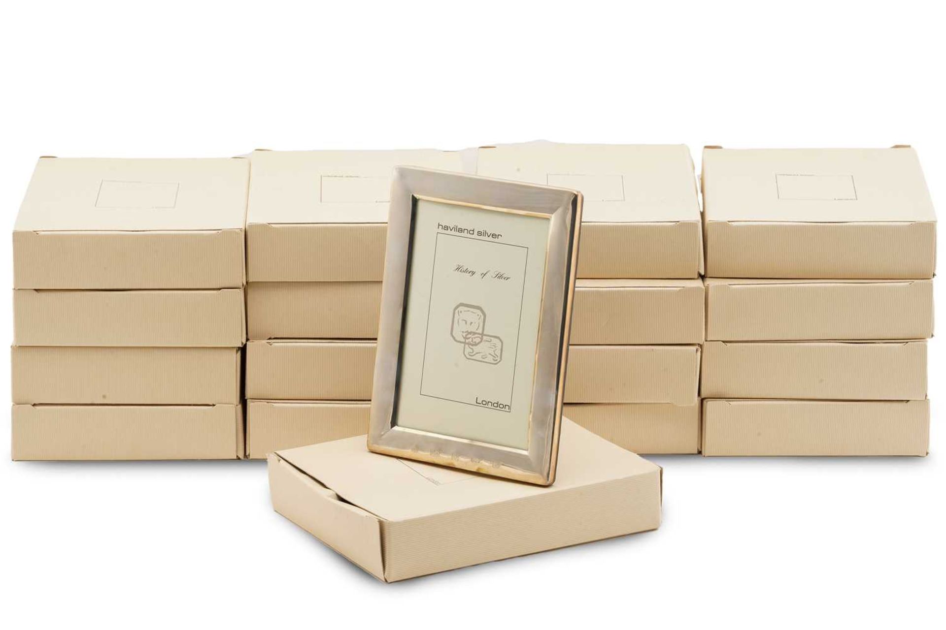 A group of seventeen boxed 4in x 6in silver photo frames; London hallmarked with A Haviland-Nye