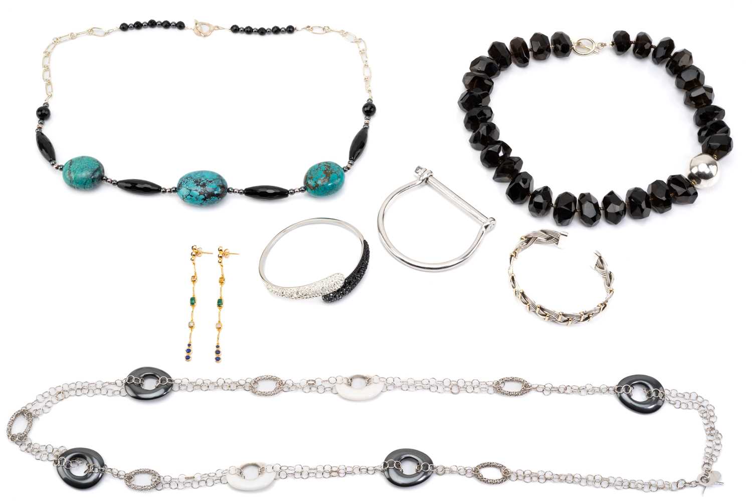 A small quantity of costume jewellery comprising a Swarovski bracelet, boxed, a white metal cuff