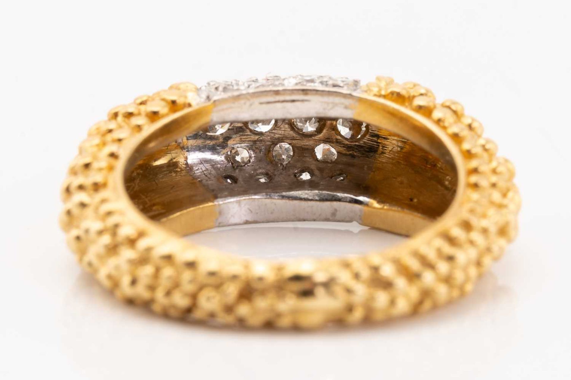 An 18 carat gold and diamond ring saddle ring; the curved centre panel pavé set with brilliant cut - Image 4 of 5