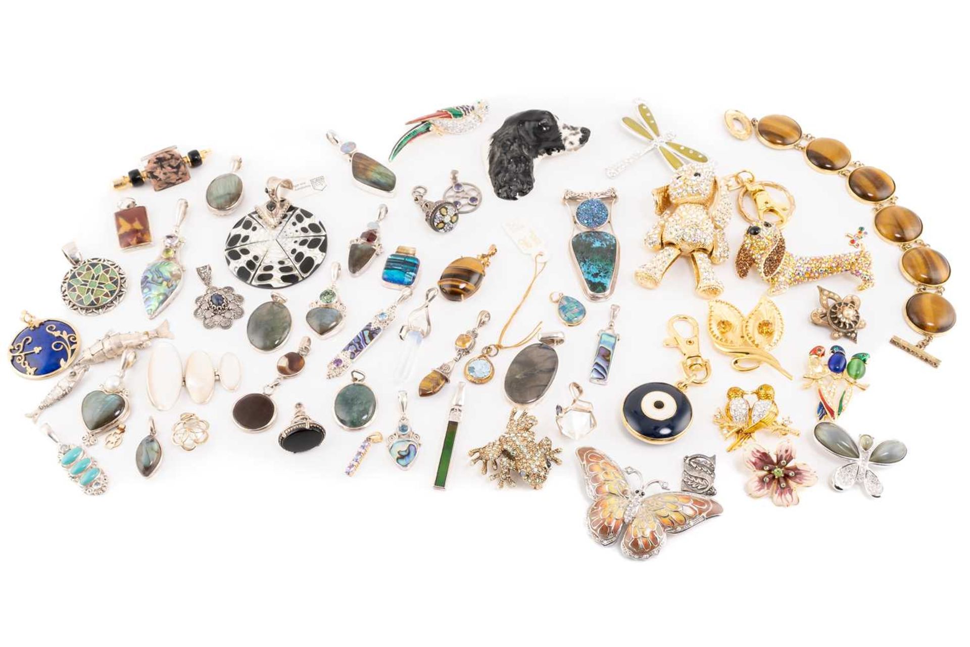 A mixed collection of thirty eight pendants, including tiger's eye pendant in 9ct, a lapis lazuli