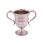A George III two handled cup; inverted bell shape with hollow side handles and central reeded