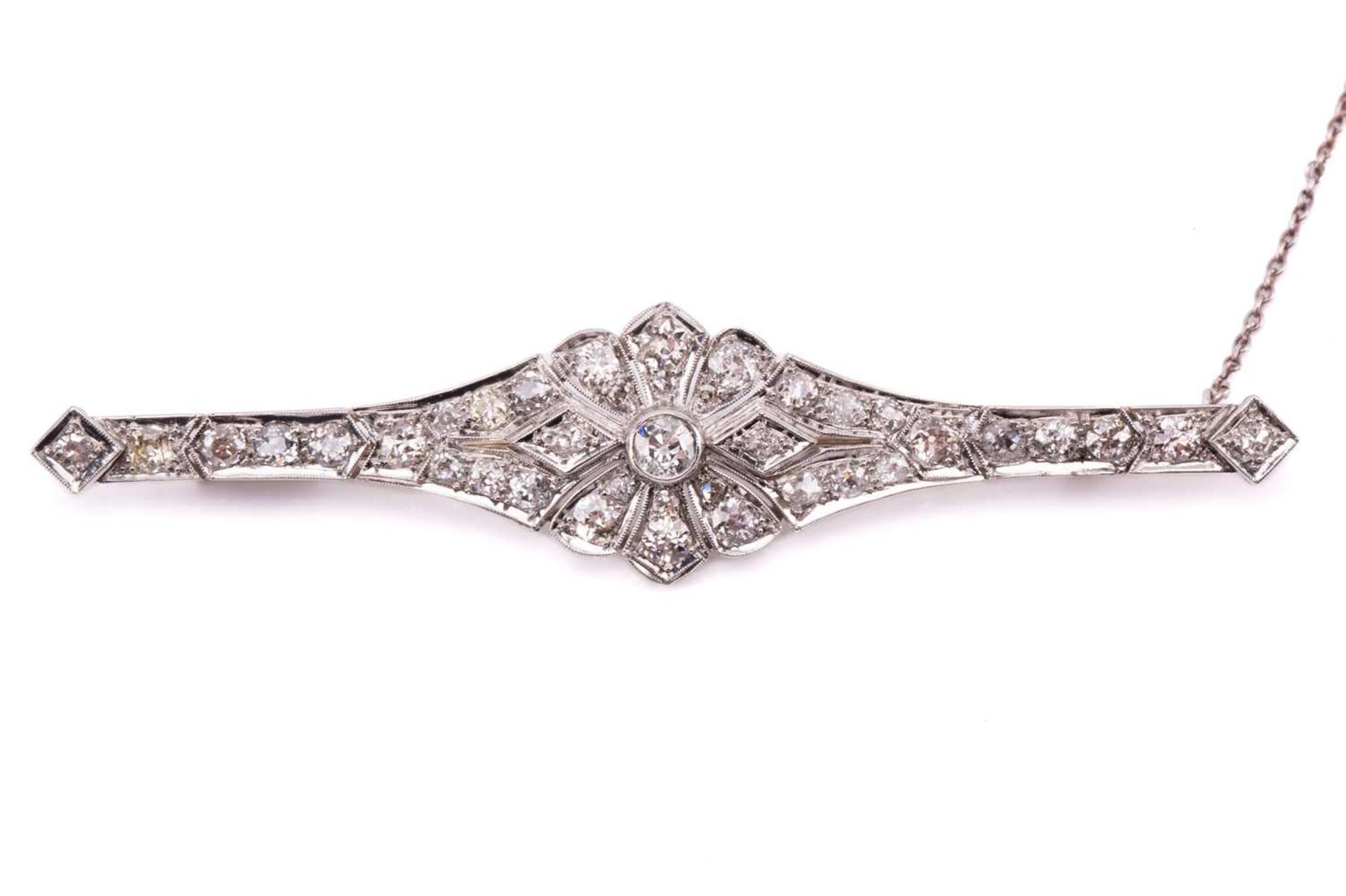 An Art Deco diamond bar brooch, of floral design, consisting of thirty-nine old-cut diamonds in