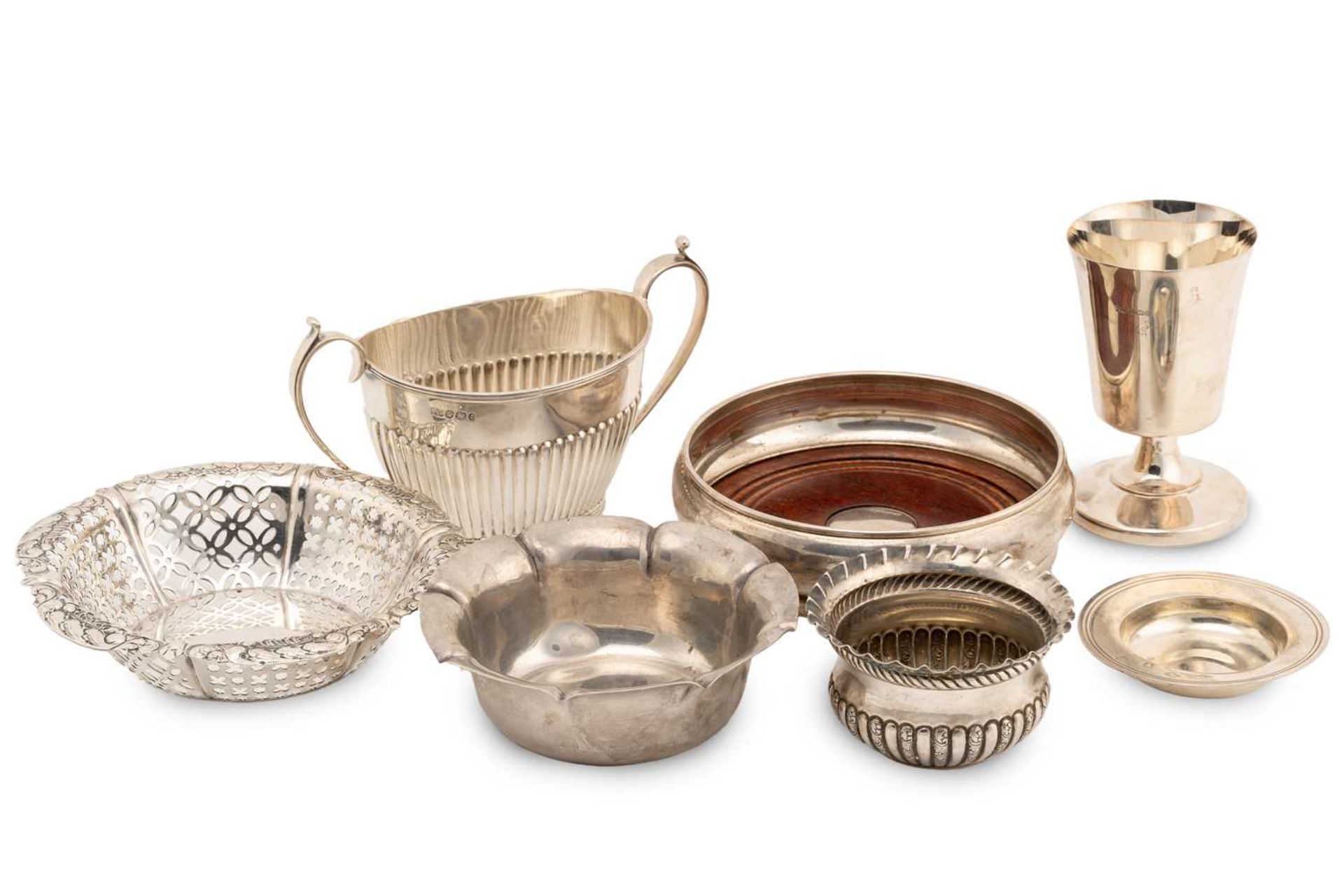 A collection of silver; including a two-handed sugar bowl with half reeded decoration, Sheffield