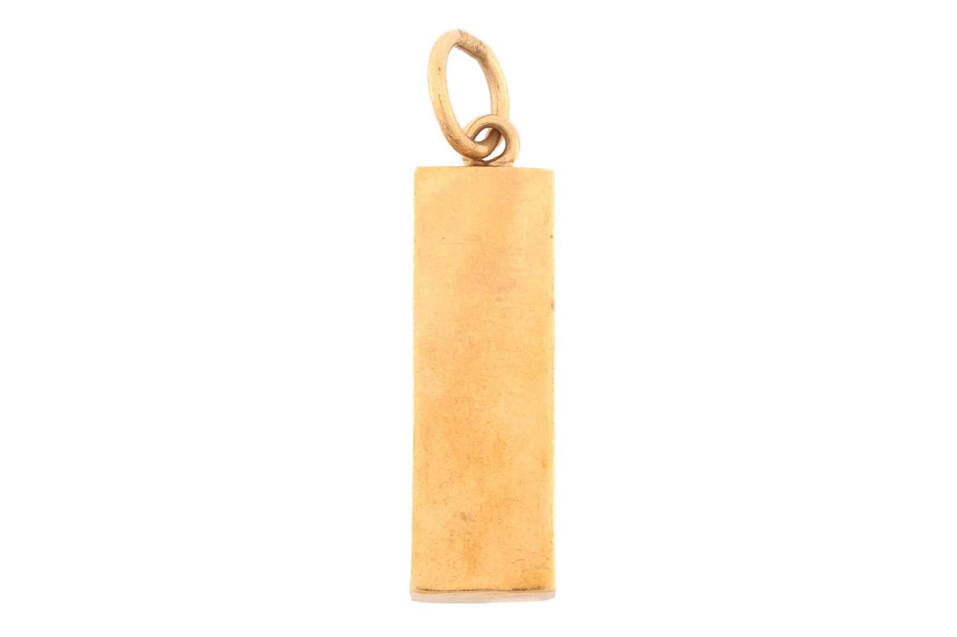 A 9 carat gold ingot pendant; dated 1977. 3.5 cm length; to a jump ring clasp. 20.68 grams - Image 2 of 3