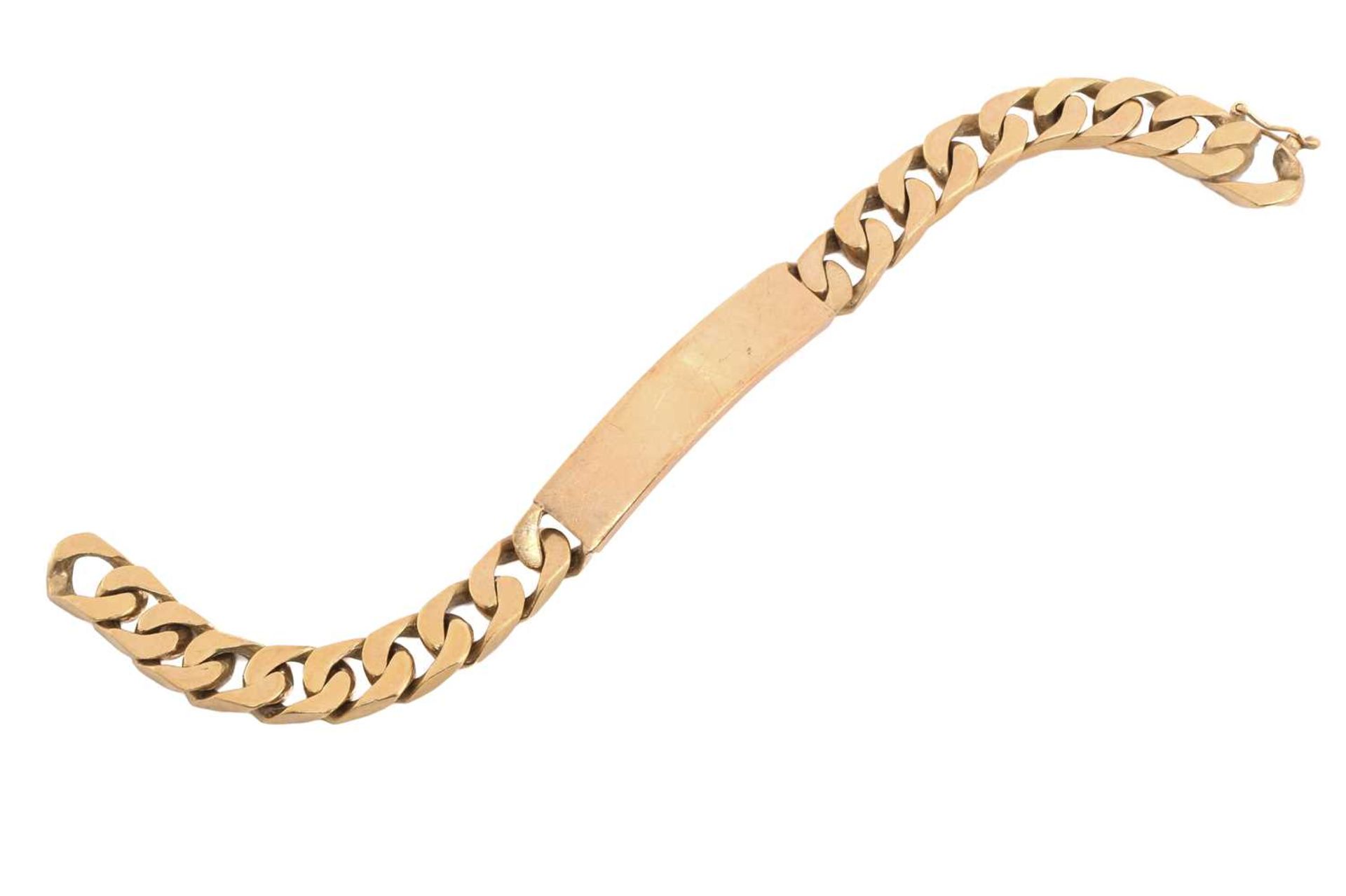 A 9ct yellow gold ID bracelet, consisting of a flat heavy curb chain attaching a curved ID tag,